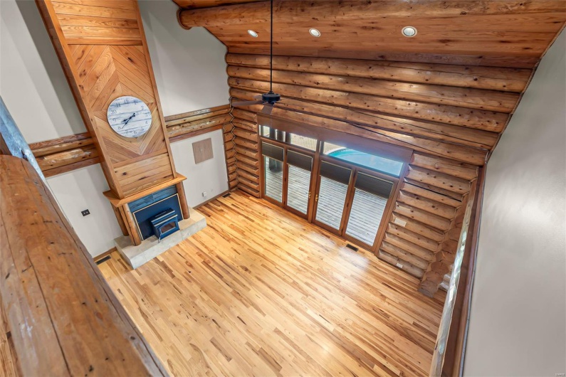 Wide Lofted Hallway Overlooking Great Room & Floor to Ceiling Fireplace