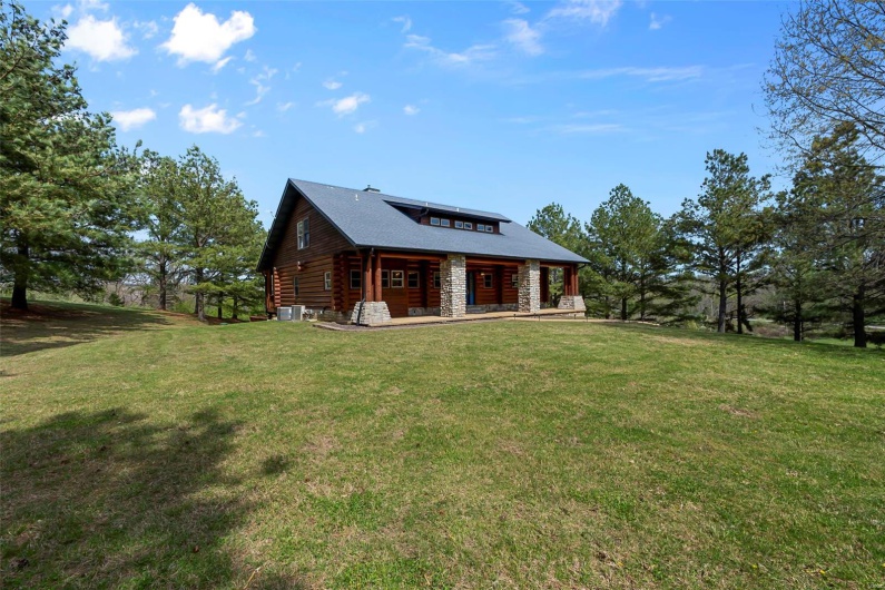 Stunning Log Home with Stone Accents Is Located Less than 1/2 Mile from Cape City Limit
