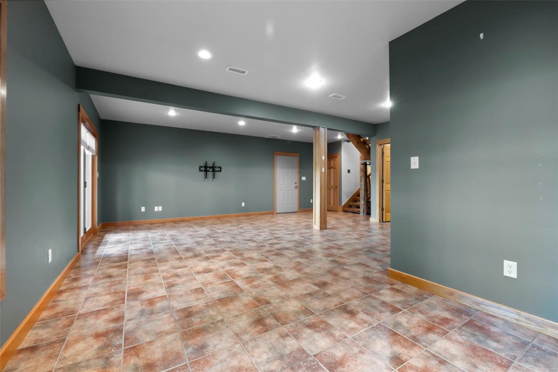 Lower Level Family/Rec Room Walks Out to Pool, Patio, Hot Tub, & Garage