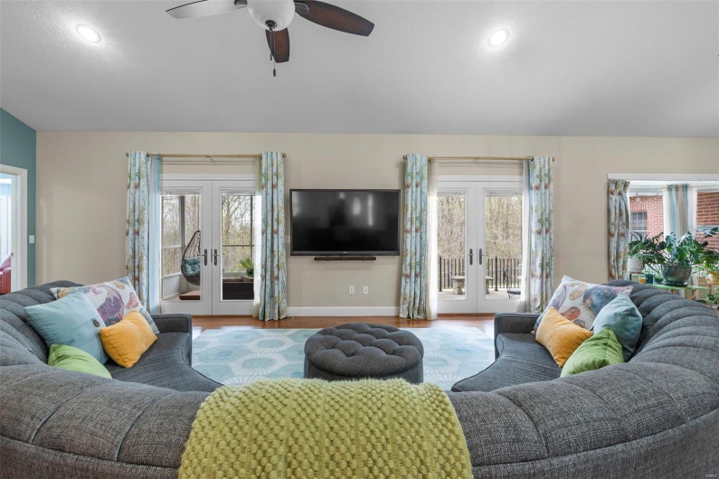 Living Room with French Doors to Sunroom & Balcony Patio