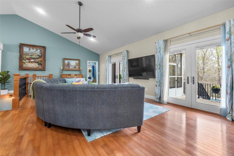 Living Room with French Doors to Sunroom & Balcony Patio