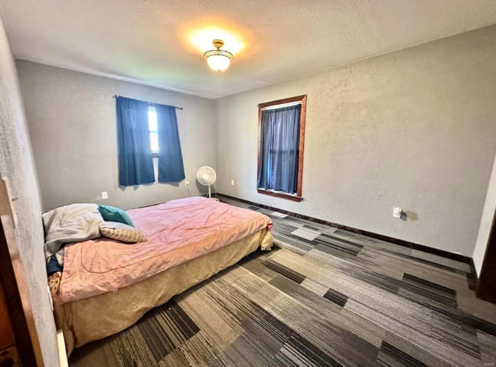 Bedroom featuring a textured ceiling