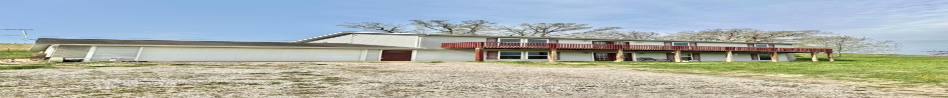 Residential For Sale Traditional home featuring a garage, driveway, and a front lawn