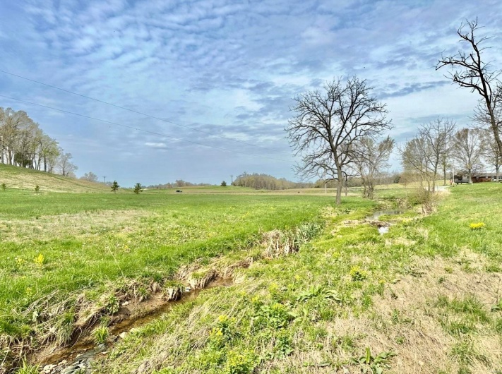 View of yard with a rural view