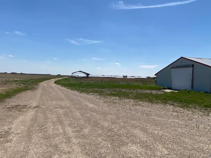 View of street with dirt driveway