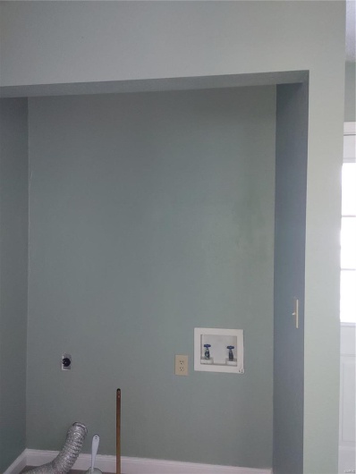 Laundry area featuring hookup for a washing machine and electric dryer hookup