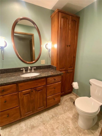 Bathroom featuring vanity and toilet