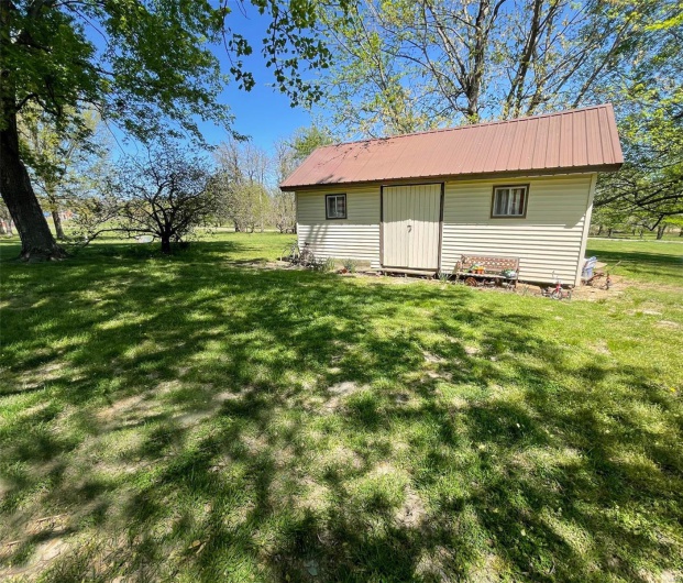 View of outdoor structure featuring an outbuilding