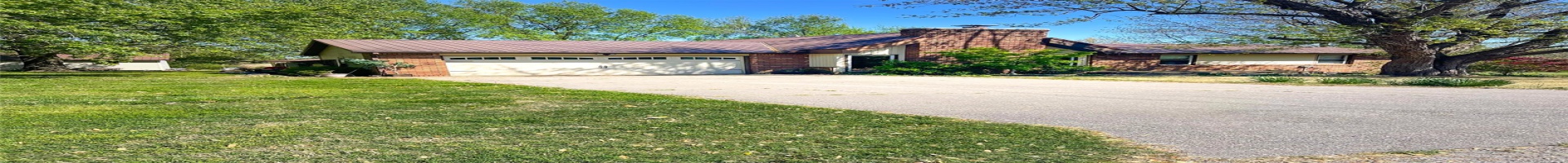Residential For Sale Ranch-style home with a front yard, an attached garage, a chimney, brick siding, and driveway