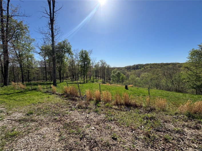 View of landscape featuring a wooded view