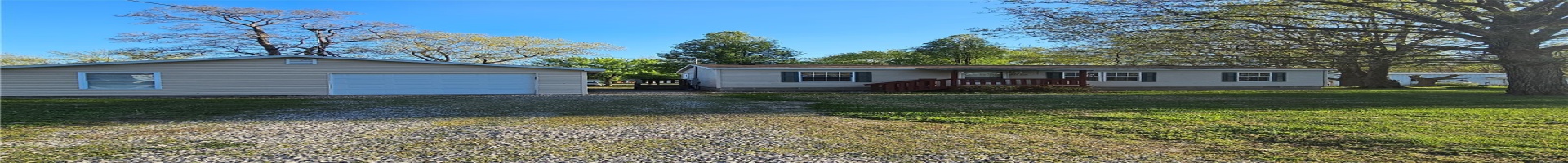 Residential For Sale View of front of property featuring a front yard, a garage, crawl space, an outbuilding, and driveway