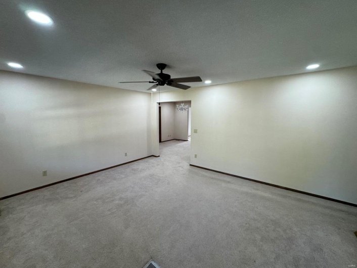 Unfurnished room with light carpet, recessed lighting, baseboards, and ceiling fan