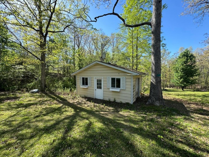 View of outbuilding featuring an outdoor structure