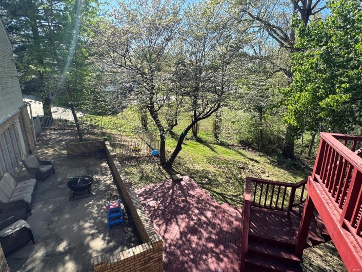 View of yard featuring a patio area, an outdoor fire pit, and a wooden deck