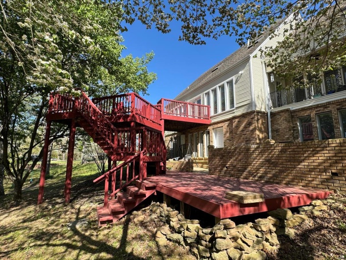 Back of house with a deck and stairway