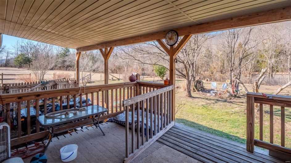 Deck featuring a lawn