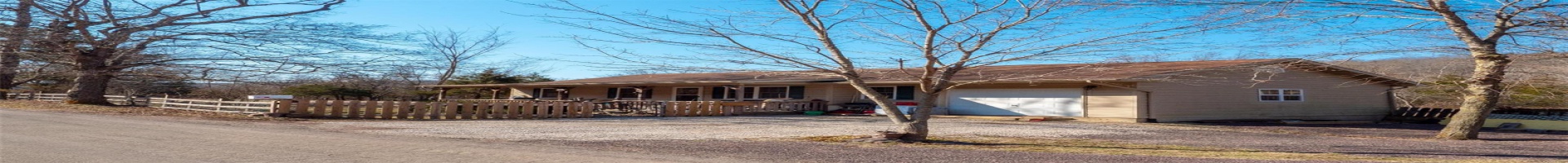 Residential For Sale Ranch-style house with an attached garage, a porch, driveway, and fence