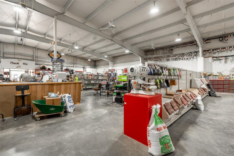 Garage with a ceiling fan and a workshop area