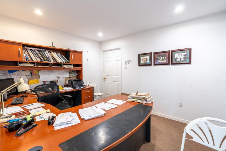Office area with baseboards, recessed lighting, and carpet flooring