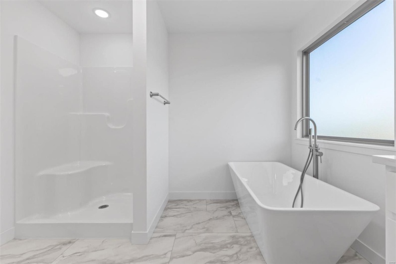 Bathroom featuring plus walk in shower