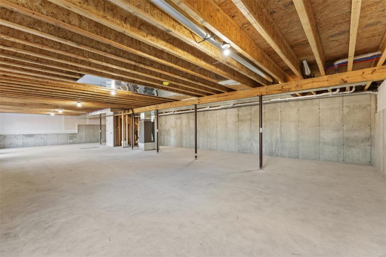 Basement featuring heating unit