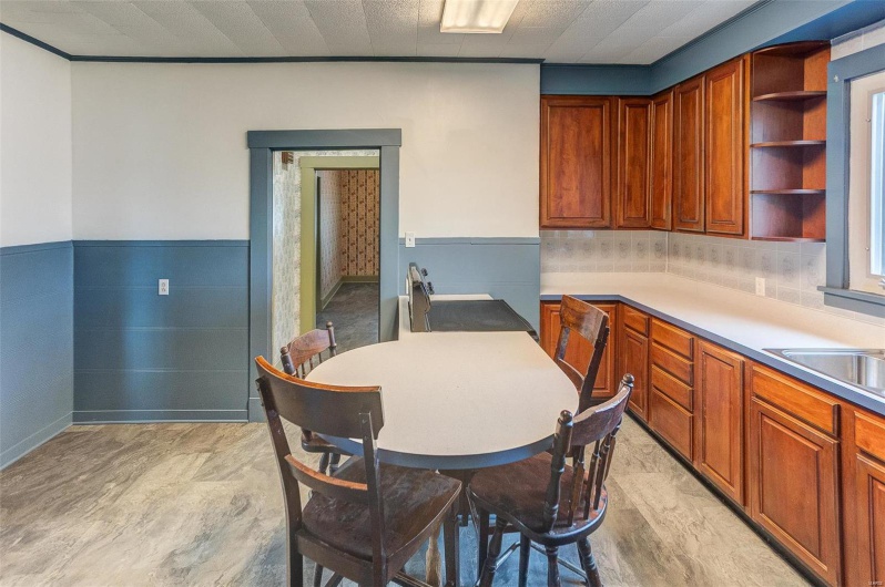 Dining area featuring a wainscoted wall