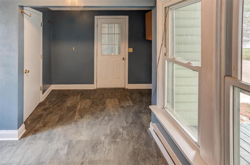 Foyer entrance featuring baseboards