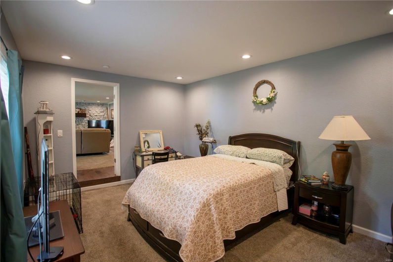 Carpeted bedroom featuring baseboards and recessed lighting