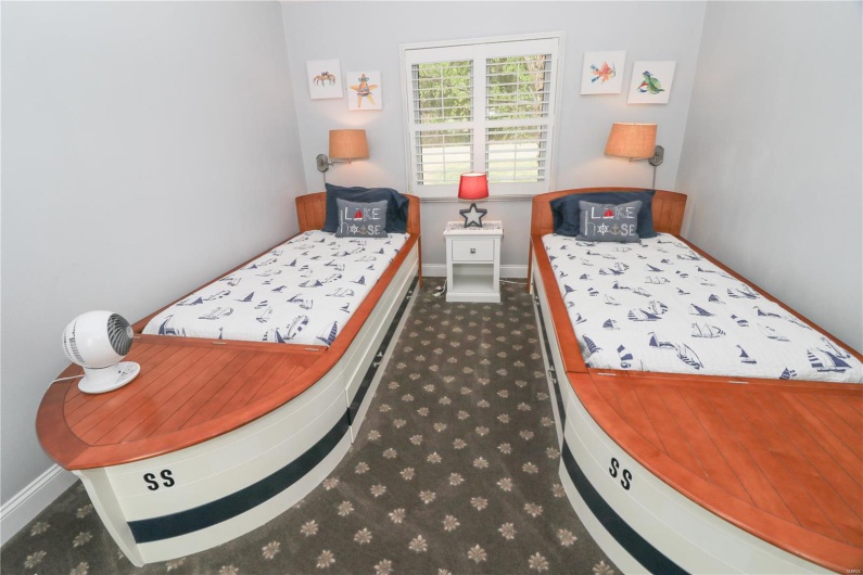 Bedroom with baseboards and carpet floors