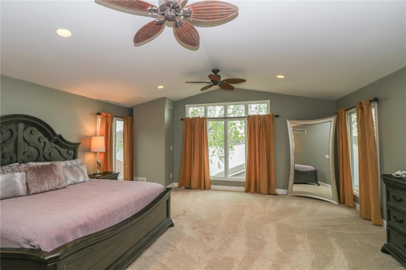 Bedroom featuring vaulted ceiling, access to outside, recessed lighting, and light colored carpet