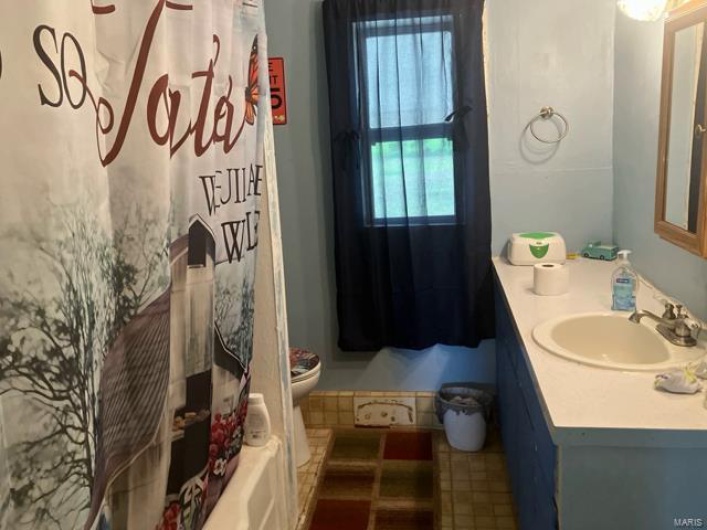 Bathroom featuring toilet and vanity