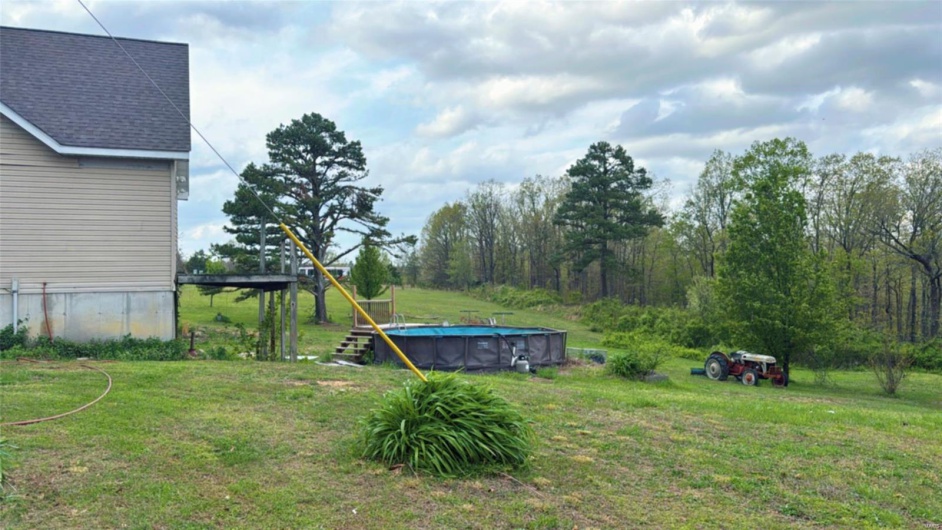 View of yard with an outdoor pool