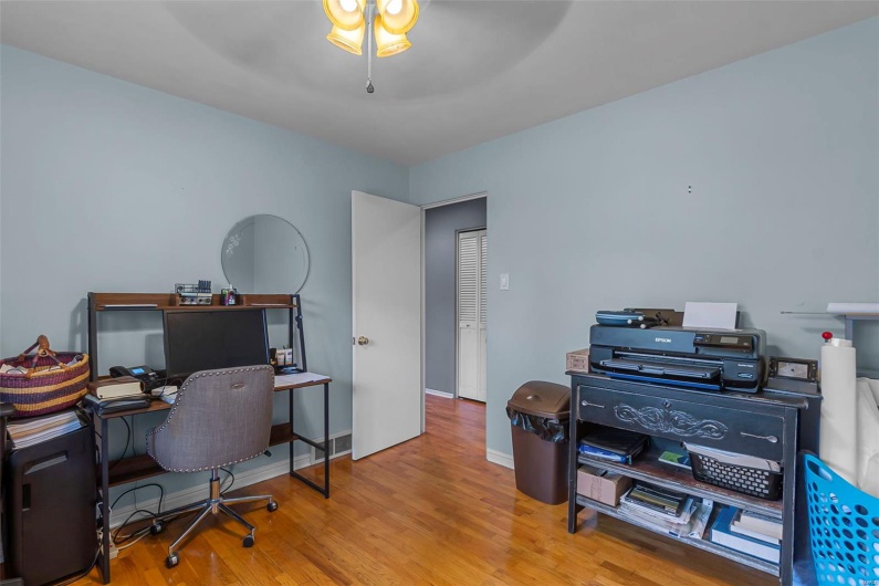 Office featuring baseboards, a ceiling fan, and wood finished floors