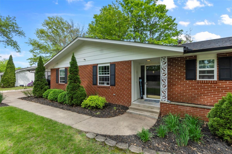 Ranch-style home featuring brick siding