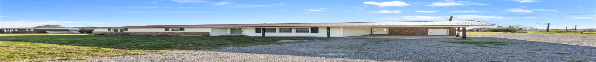Residential For Sale Ranch-style house featuring driveway, a carport, a front yard, metal roof, and brick siding
