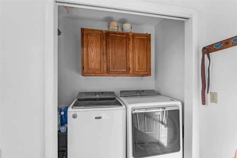 Laundry area with washing machine and clothes dryer and cabinet space