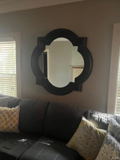 Living room featuring crown molding