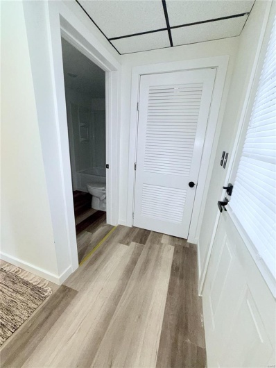 View facing bathroom and utility closet.