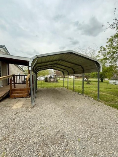 Carport, more parking to right of carport.