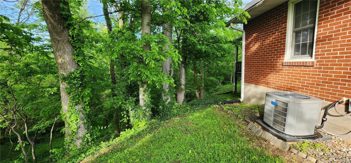View of yard featuring central AC unit
