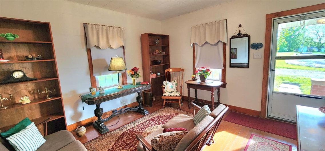 Living area featuring wood finished floors and baseboards