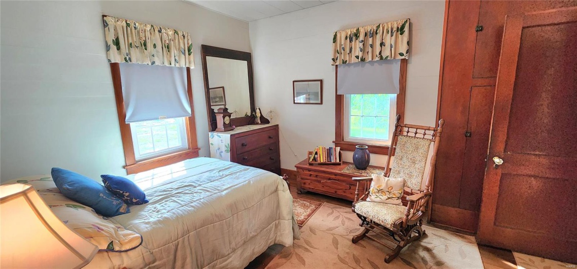 Bedroom featuring multiple windows