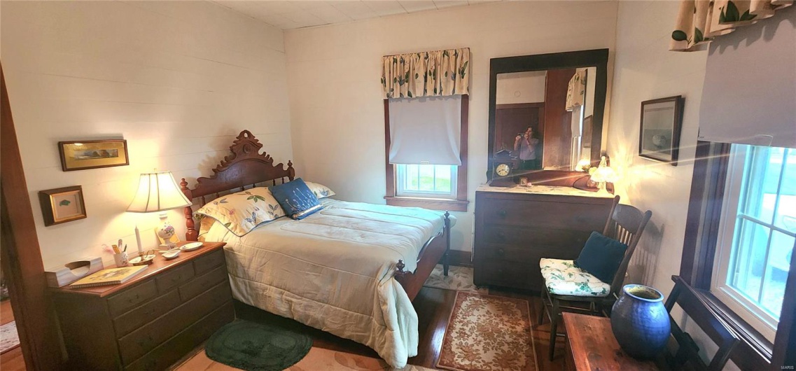 Bedroom featuring multiple windows