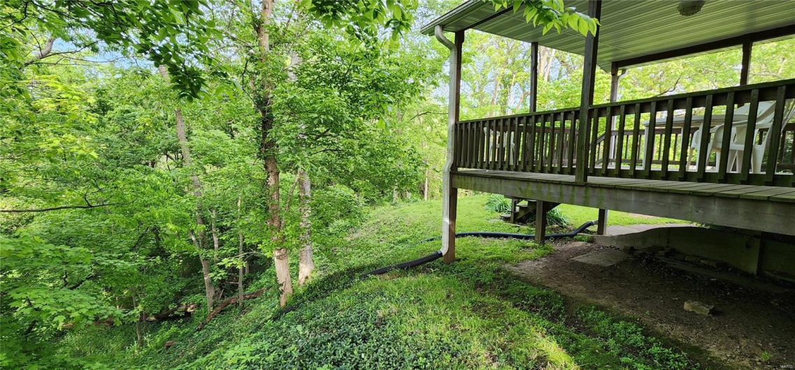 View of yard with a deck
