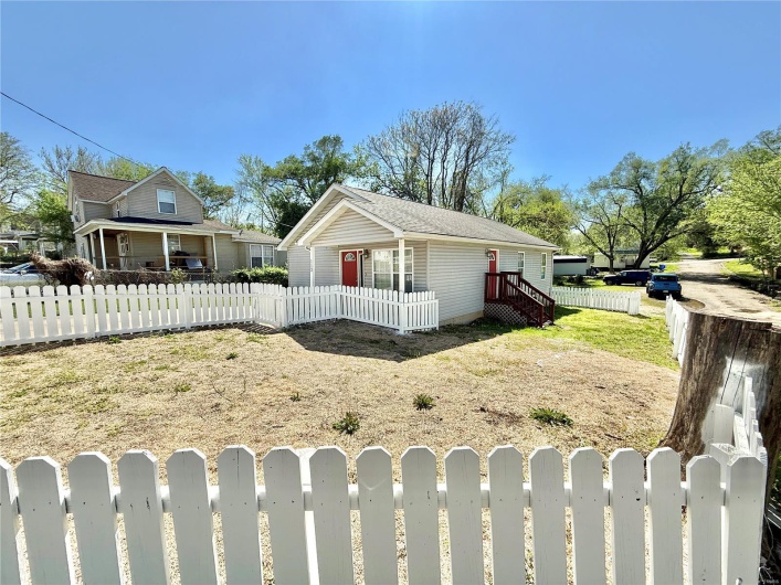 Bungalow-style house with a fenced front yard