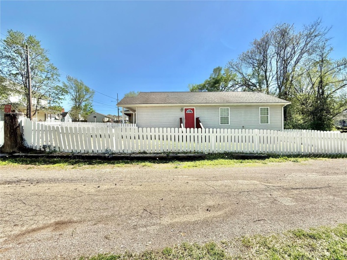 View of front of house featuring a fenced front yard