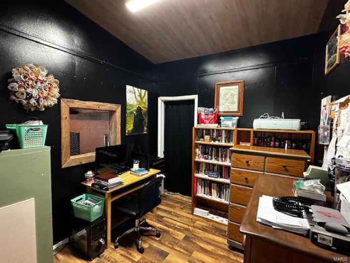 Office space with wooden ceiling, hardwood / wood-style floors, and vaulted ceiling