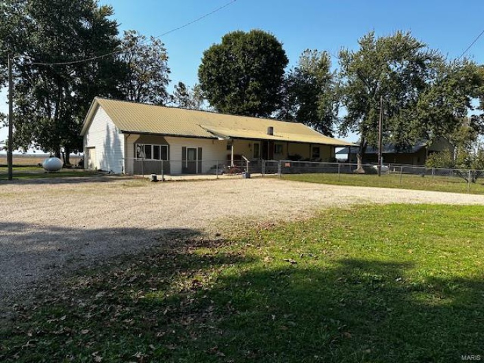 Single story home featuring a front lawn