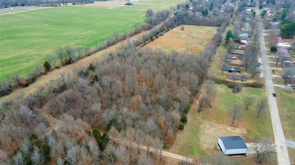 Birds eye view of property featuring a rural view