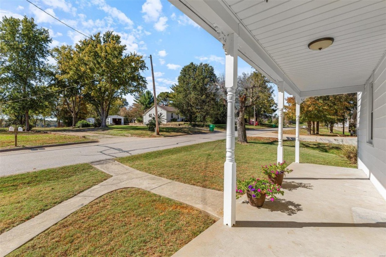 View of yard featuring covered porch